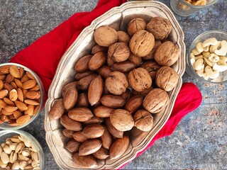 Mixed nuts bowls and a red kitchen towel