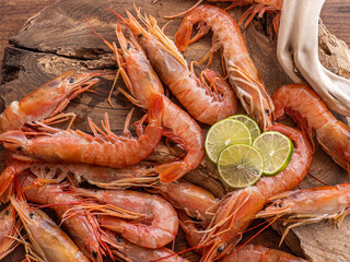 Close-up of giang raw shrimps, prawns on a wooden board