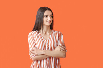 Fototapeta premium Portrait of beautiful young woman on color background
