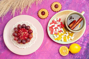 top view little cookies with cup of tea on the pink background biscuit cake sweet dessert