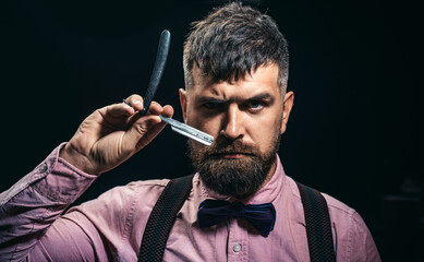 Barber portrait. Handsome man with barbershop equipment.