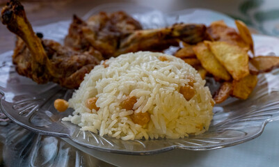Rice, grilled chicken chop, french fries ...