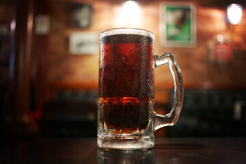 cold beer glass at empty pub 
