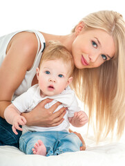 Mother and baby playing and smiling. Happy family.