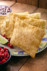 Brazilian pastry, traditional fried dough called pastel with lemon or pepper, typical Brazilian food