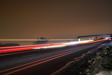 Photographed the headlights and lights of cars, on the freeway, at night.

