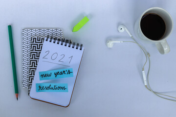 new year's resolutions for 2021 written in notebook on the table