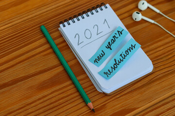 new year's resolutions for 2021 written in notebook on the table