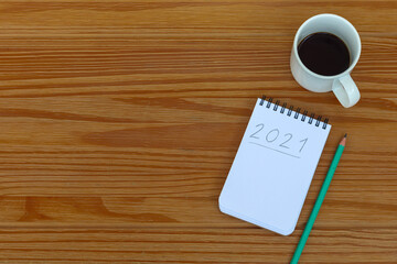 new year's resolutions for 2021 written in notebook on the table