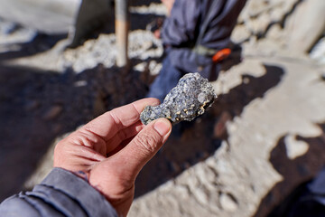silver ore in shape of a small rock that needs to be processed to generate pure silver. Silver...