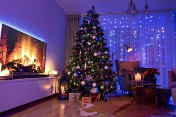 Christmas decorated luxury room with candle lights , gifts and Christmas decorated tree
