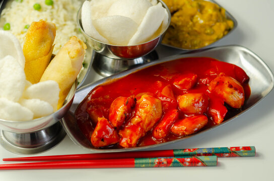 Chinese Set,  Chicken Curry, Sweet And Sour Chicken Served With Egg Fried Rice, Vegetable Spring Rolls, And Prawn Crackers