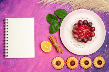 top view little cookies with cake on pink background sweet biscuit cakes dessert
