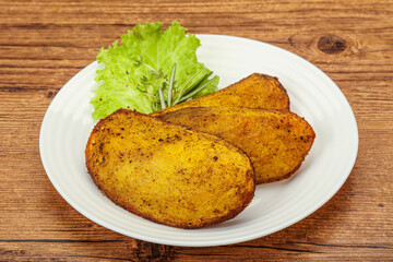 Baked potato with herbs and spices