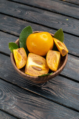 front view fresh sweet persimmons on a wooden rustic desk mellow fruit tree health