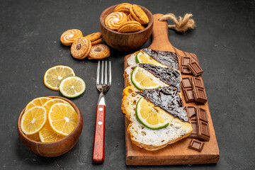 front view cake slices with chocolate and cookies on dark background cake sweet pie dessert
