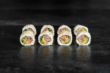 Sushi Rolls. Sushi Rolls Set, maki, philadelphia and california rolls, on a Black background.
