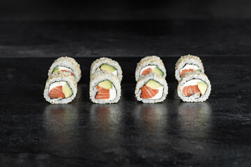 Sushi Rolls. Sushi Rolls Set, maki, philadelphia and california rolls, on a Black background.