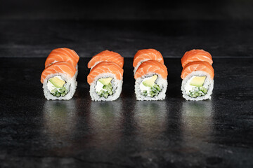 Sushi Rolls. Sushi Rolls Set, maki, philadelphia and california rolls, on a Black background.