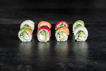 Sushi Rolls. Sushi Rolls Set, maki, philadelphia and california rolls, on a Black background.