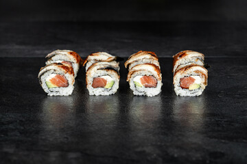 Sushi Rolls. Sushi Rolls Set, maki, philadelphia and california rolls, on a Black background.