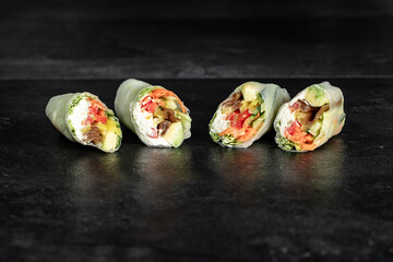 Sushi Rolls. Sushi Rolls Set, maki, philadelphia and california rolls, on a Black background.
