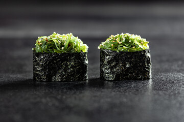 Sushi Rolls. Sushi Rolls Set, maki, philadelphia and california rolls, on a Black background.