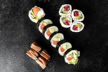 Sushi Rolls. Sushi Rolls Set, maki, philadelphia and california rolls, on a Black background.