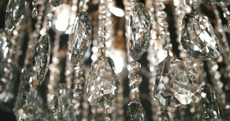 Crystals closeup. Crystal modern chandelier detail background. Hanging diamonds with blinking...