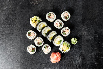 Sushi Rolls. Sushi Rolls Set, maki, philadelphia and california rolls, on a Black background.