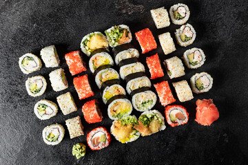 Sushi Rolls. Sushi Rolls Set, maki, philadelphia and california rolls, on a Black background.