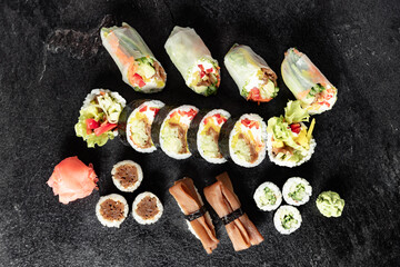 Sushi Rolls. Sushi Rolls Set, maki, philadelphia and california rolls, on a Black background.