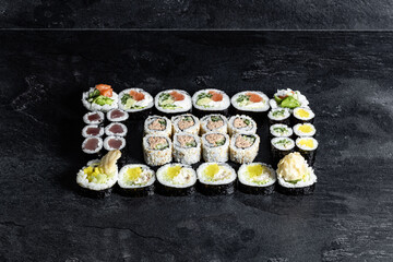 Sushi Rolls. Sushi Rolls Set, maki, philadelphia and california rolls, on a Black background.
