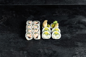 Sushi Rolls. Sushi Rolls Set, maki, philadelphia and california rolls, on a Black background.
