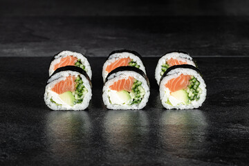 Sushi Rolls. Sushi Rolls Set, maki, philadelphia and california rolls, on a Black background.
