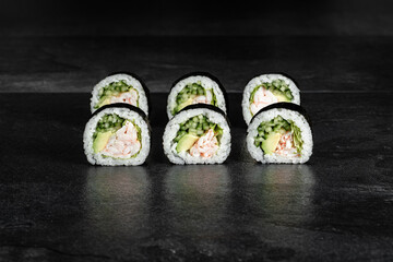 Sushi Rolls. Sushi Rolls Set, maki, philadelphia and california rolls, on a Black background.