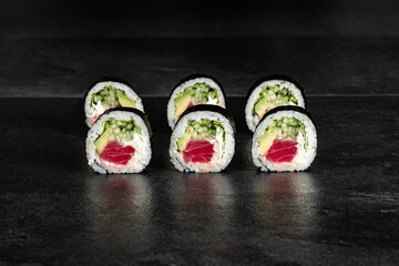 Sushi Rolls. Sushi Rolls Set, maki, philadelphia and california rolls, on a Black background.