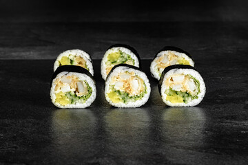 Sushi Rolls. Sushi Rolls Set, maki, philadelphia and california rolls, on a Black background.