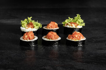 Sushi Rolls. Sushi Rolls Set, maki, philadelphia and california rolls, on a Black background.
