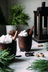 Cocoa with marshmallows in a glass on a New Year's table