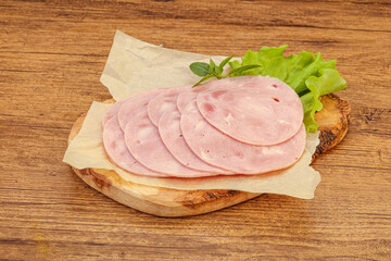 Slised ham snack over board
