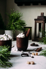 Cocoa with marshmallows in a glass on a New Year's table