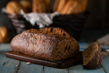 Fresh sliced ​​rye bread on wooden rustic table