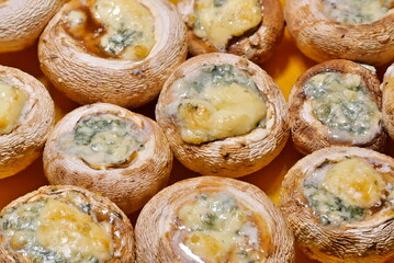 Baked mushrooms stuffed with cheese.