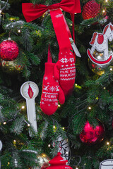 Christmas tree. New Year's toys. Cones, mittens, gloves, bows, balls, garlands. Concept of New...