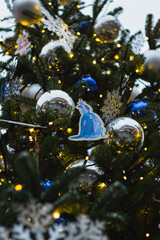 Christmas tree. New Year's toys. Cones, mittens, gloves, bows, balls, garlands. Concept of New...