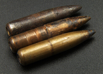 vintage rifle bullets on black background