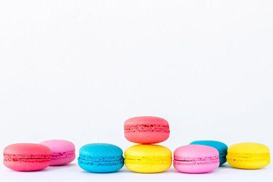 Colored macarons lined up on top of each other
