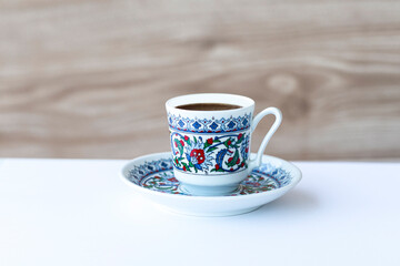 Sparkling Turkish coffee in a classic patterned Turkish Cup.