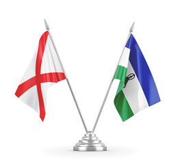 Lesotho and Northern Ireland table flags isolated on white 3D rendering